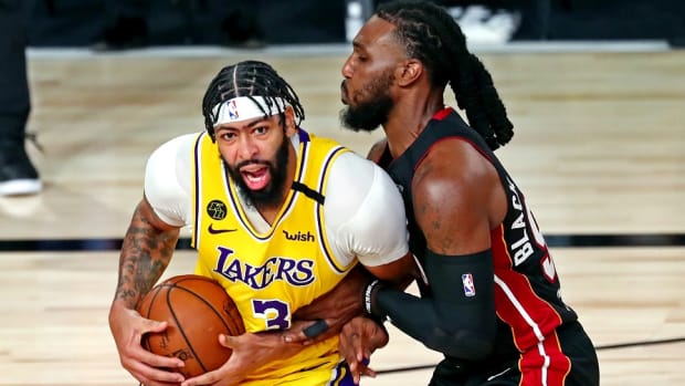 Los Angeles Lakers forward Anthony Davis drives to the basket against Miami Heat forward Jae Crowder during the 2020 NBA Finals at AdventHealth Arena.